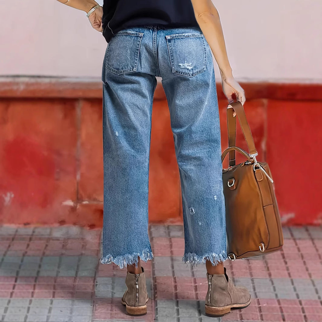 Jeans lurus peregangan robek dengan kenyamanan gerak yang mudah