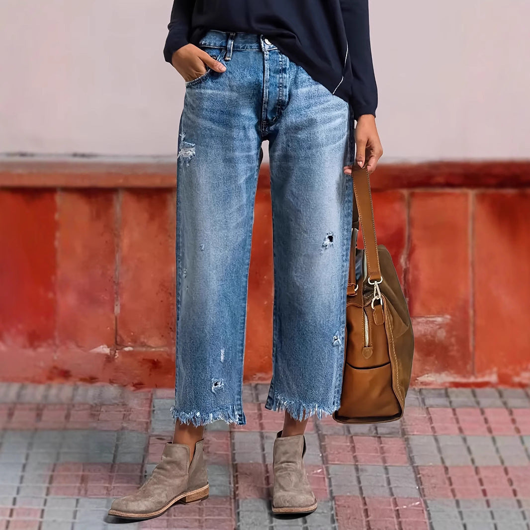 Jeans lurus peregangan robek dengan kenyamanan gerak yang mudah