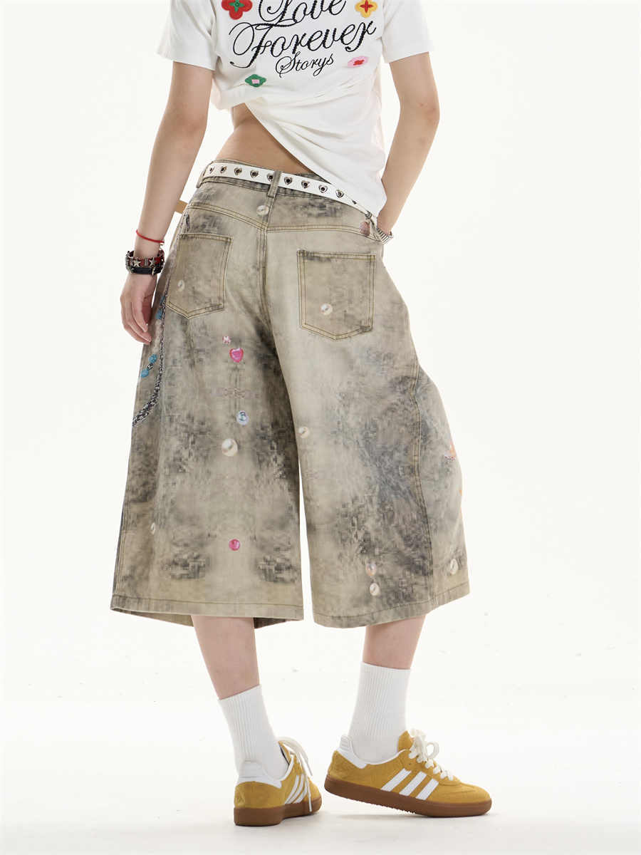 Jeans de patas anchas creativas con arte impreso
